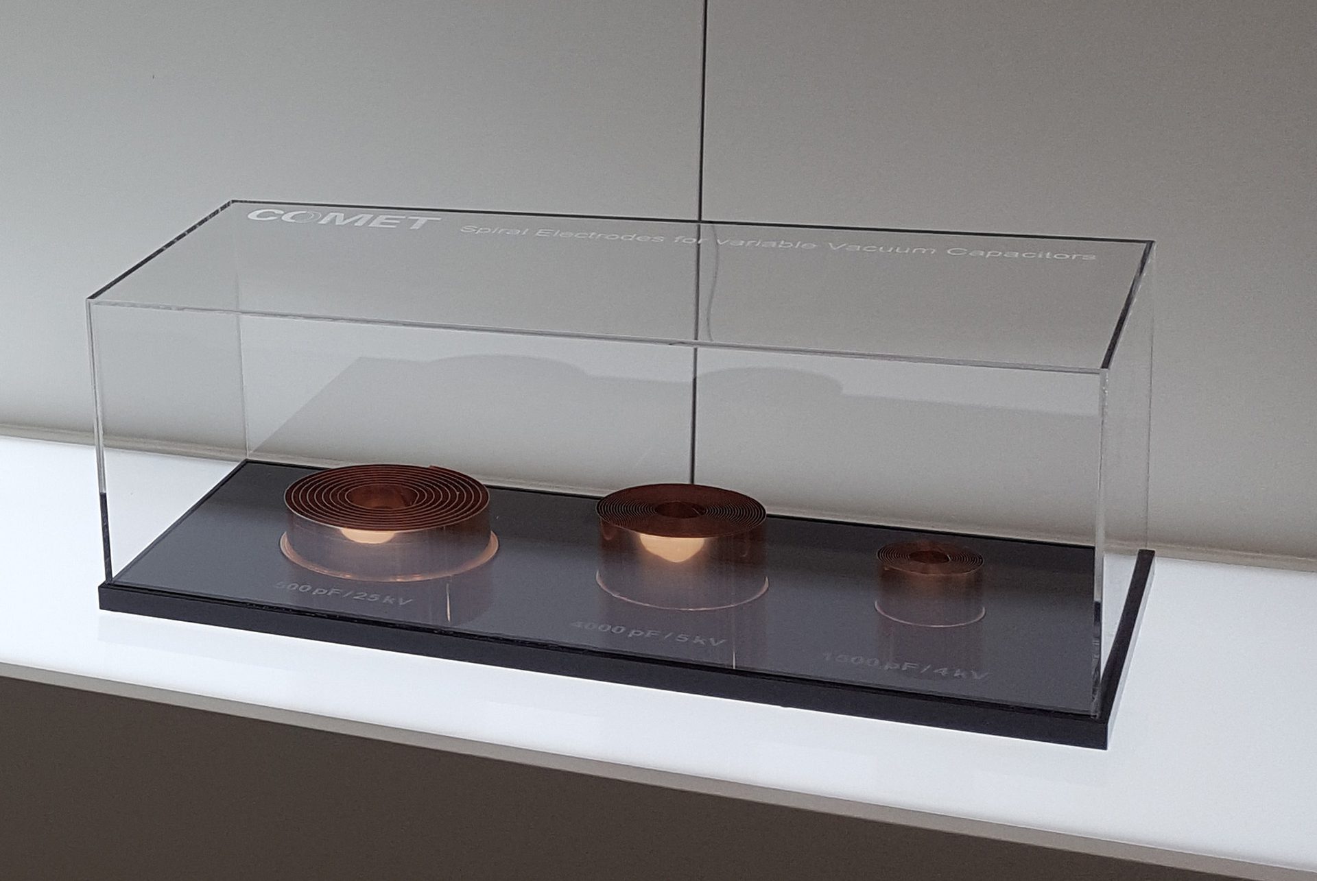 Transparent cover on a black plinth with the three electrodes