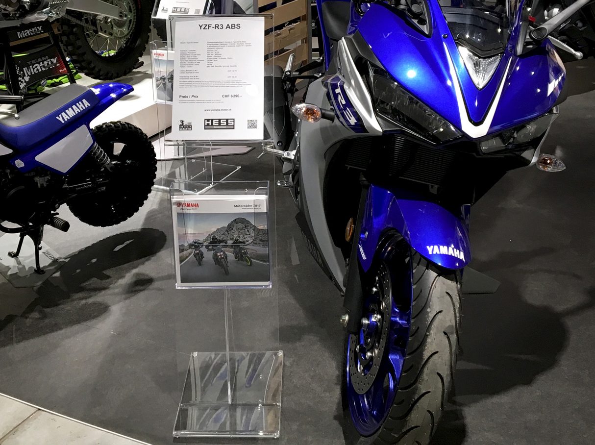 Several information stands among the motorcycles on display in the showroom